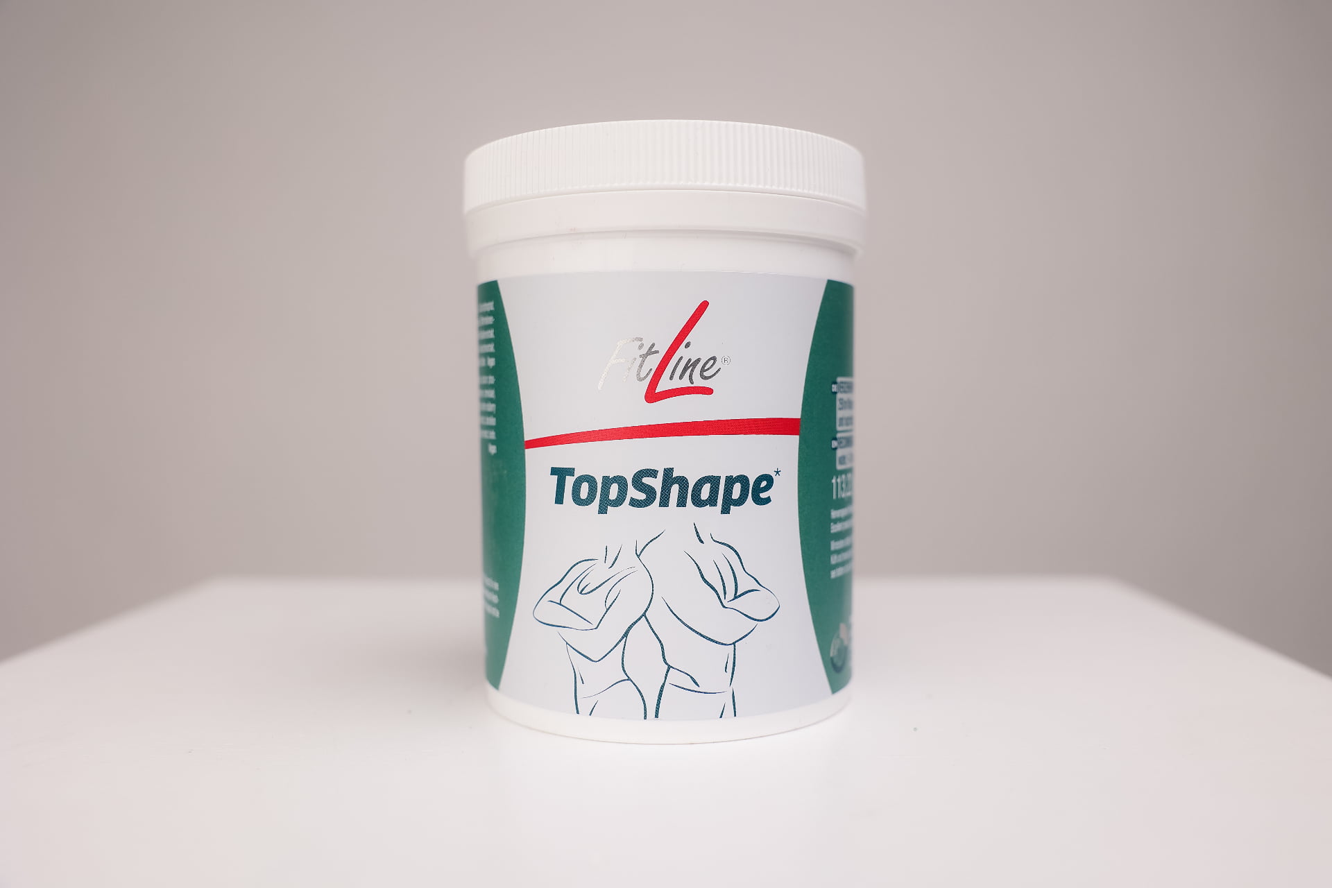 FitLine TopShape maisto papildas svorio valdymui su biotinu ir cinku - baltas indelis su NTC technologijos ženklu